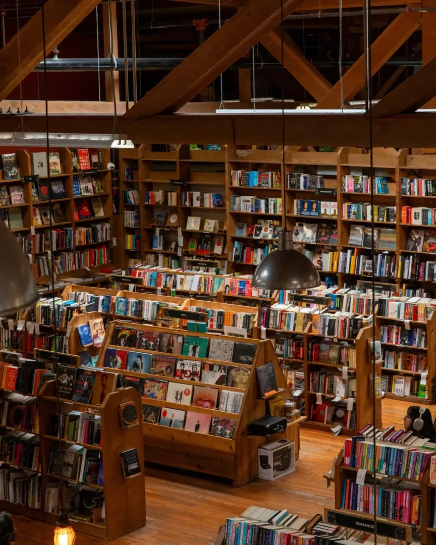 Rustic wooden bookshelves fill the cozy interior of Elliott Bay Book Company in Capitol Hill Seattle.