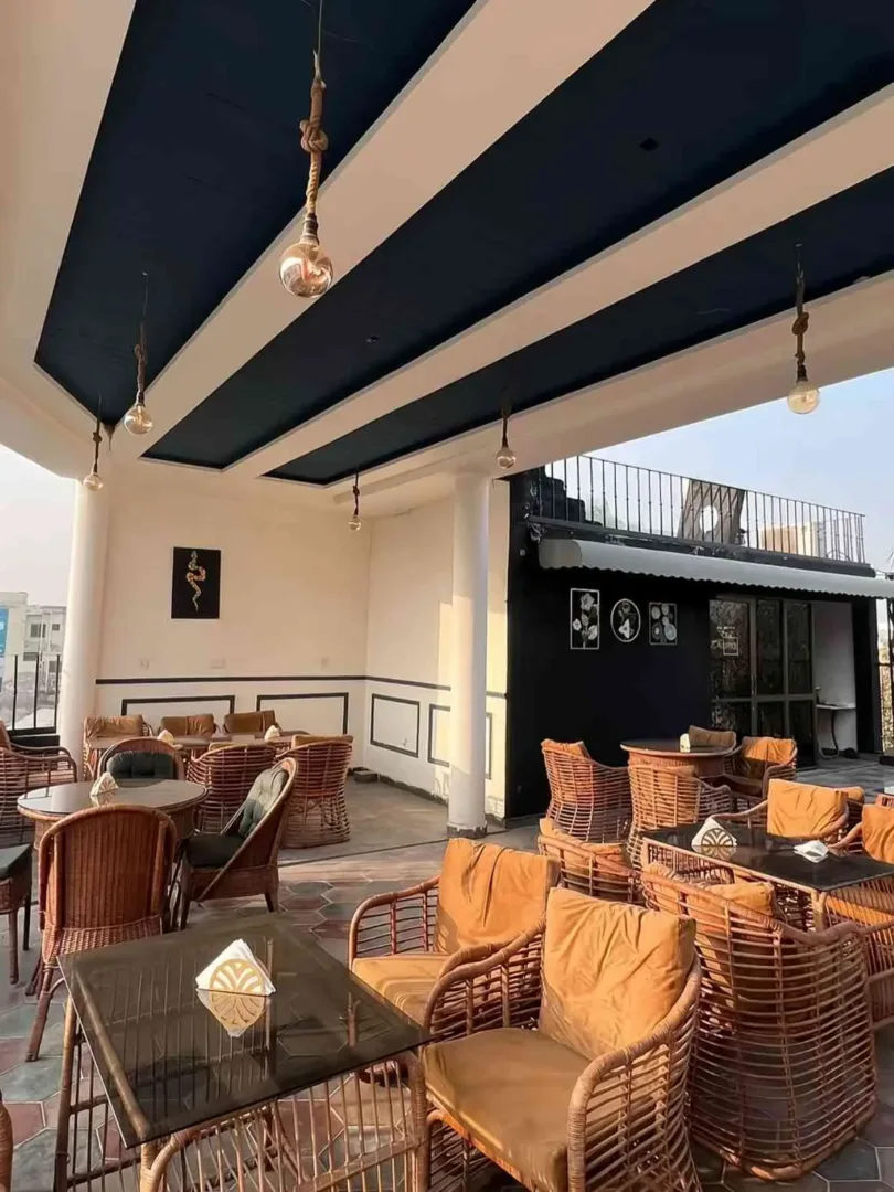 The outdoor patio of a stylish, modern restaurant is perfect for dining in Seattle in July.