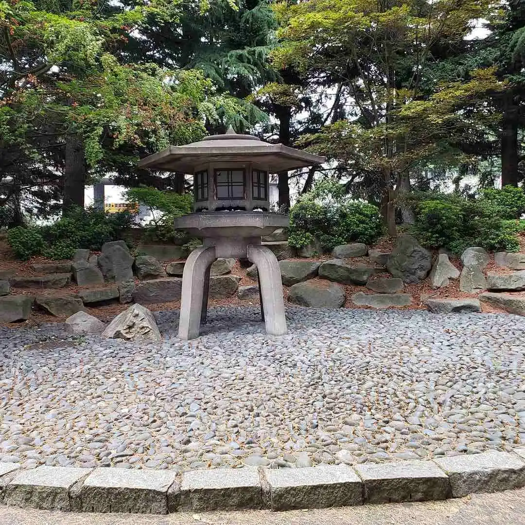 Stone lantern on a pebble path in Kobe Terrace Park, next to the International District Seattle.