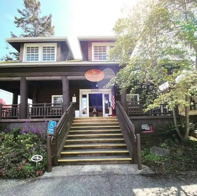 Exterior of the historic Log House Museum, a cultural landmark featured in this West Seattle Guide.
