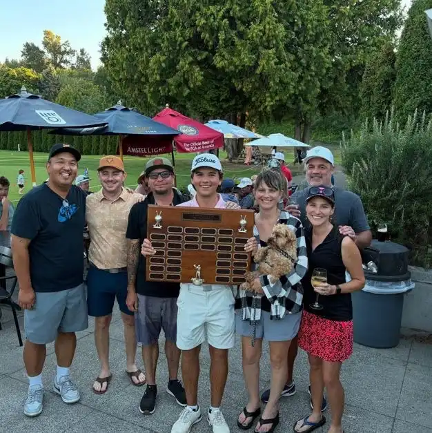 Friends celebrating at the West Seattle Golf Course, a premier outdoor spot in this West Seattle Guide.