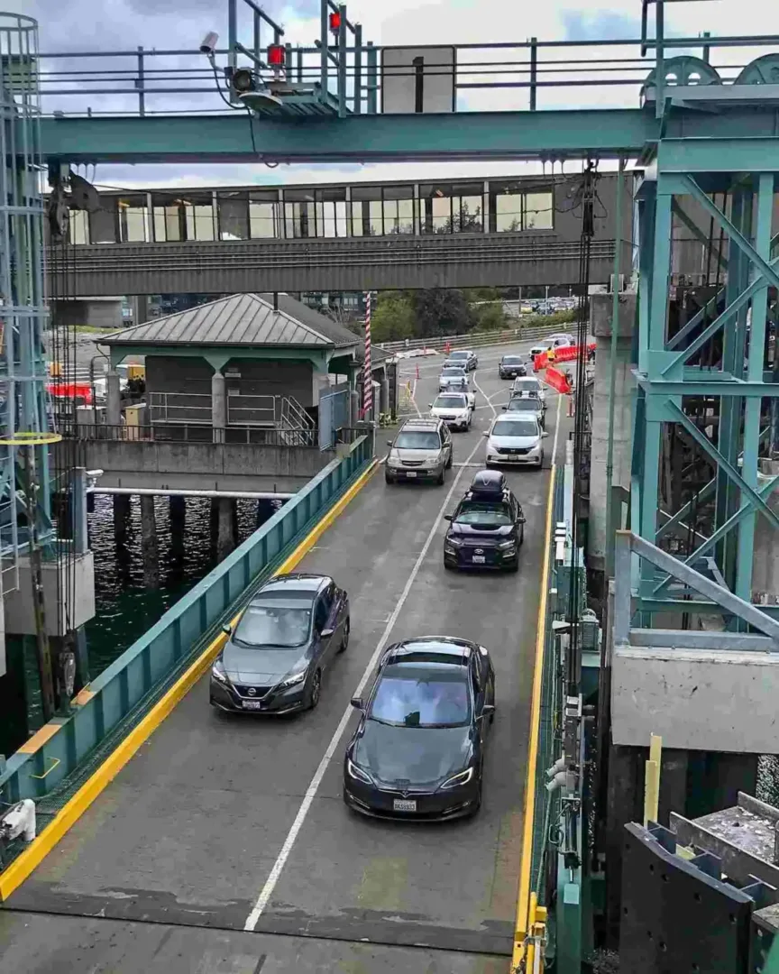 Vehicles drive onto the loading ramp at the busy Bainbridge Island Ferry Seattle terminal in Washington.