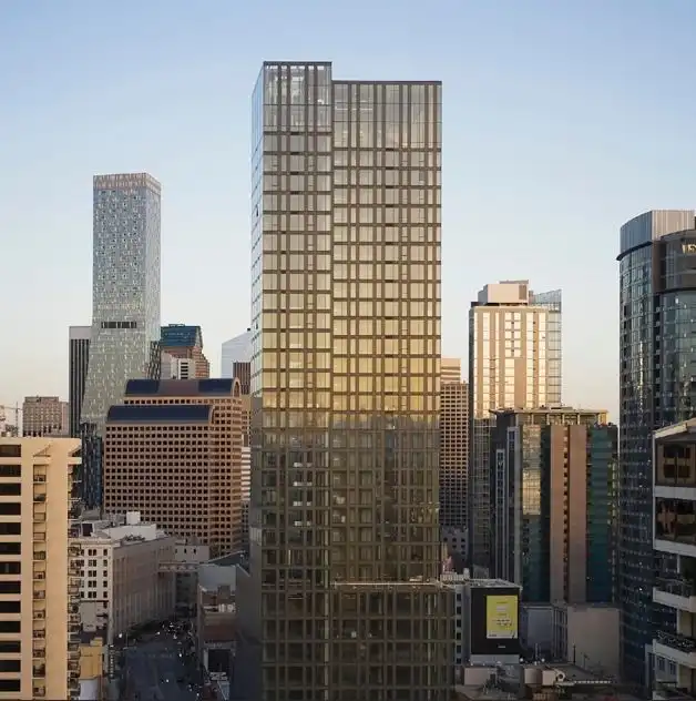 Sunlight reflects off glass skyscrapers and modern residential towers throughout the vibrant downtown Seattle urban landscape.