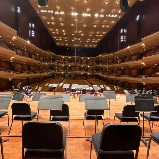 An empty orchestra stage with music stands faces tiers of seating in this downtown Seattle theater.