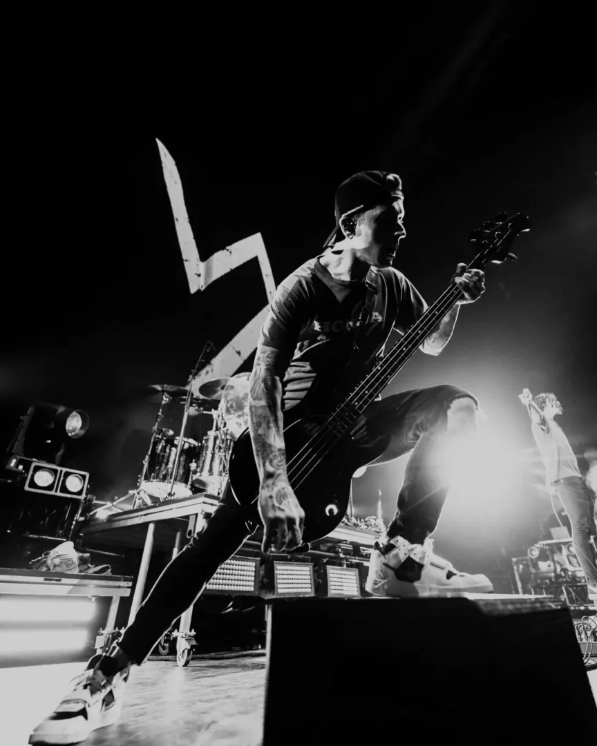A rock band performs live on stage, capturing the raw energy of the Seattle music scene.