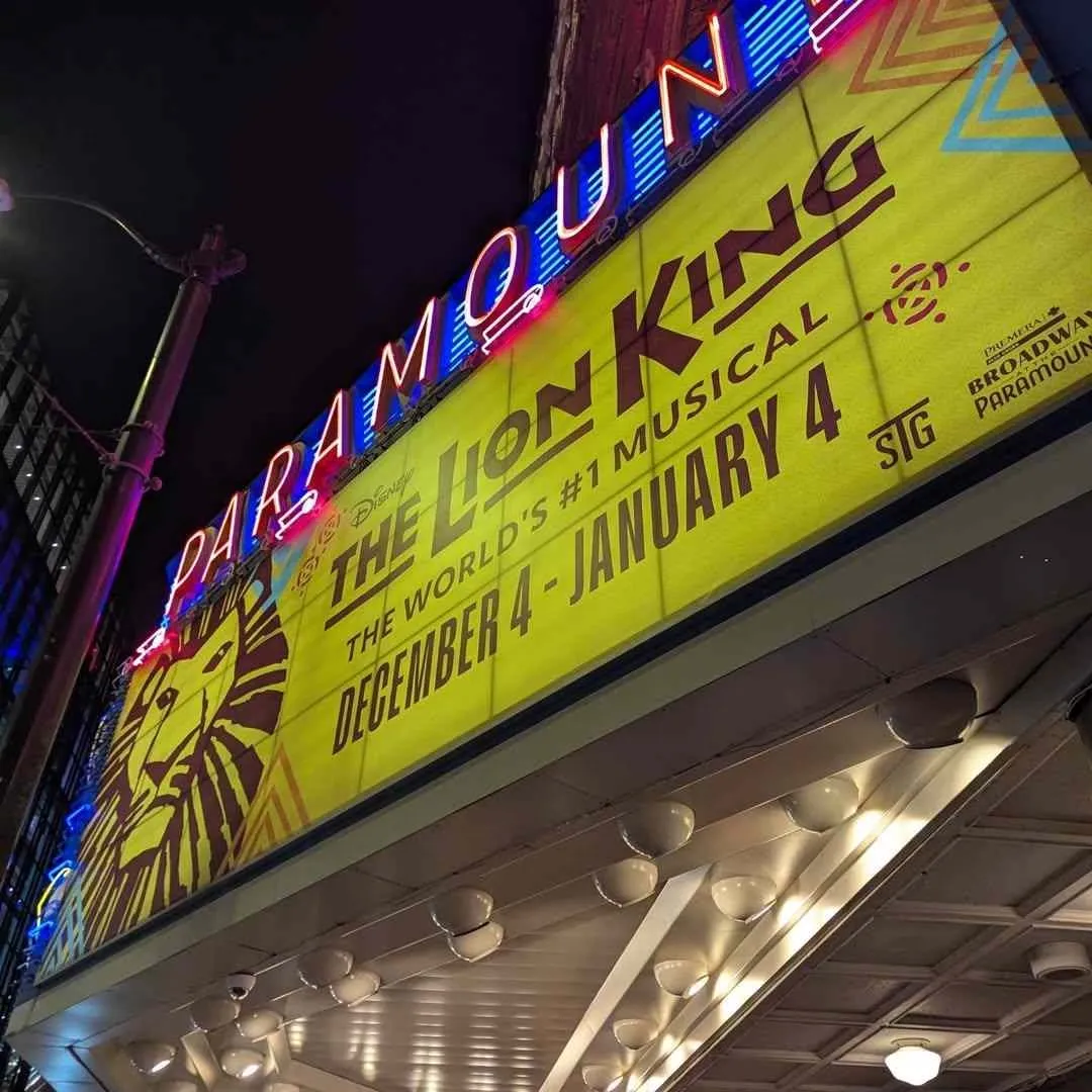 The Paramount Theatre marquee displays The Lion King musical as featured in the Seattle Theater Guide.